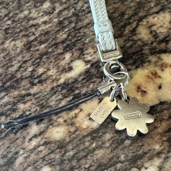 Coach White Wristlet with Orange Flower Phone Charm - Picture 3 of 4